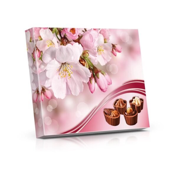 These delightful filled chocolate cups come in a charming flower shape, elegantly tied with a bow. Inside, you'll find a delicious filling that complements the rich, smooth chocolate exterior. Perfect for gifting, these treats add a touch of beauty and sweetness to any occasion.