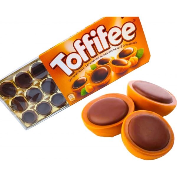 A delicious treat featuring a creamy hazelnut center, caramel, and a smooth layer of chocolate, offering a perfect balance of sweet and nutty flavors.